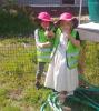 Little gardeners from Cooperation Station learned watering skills this summer - Photo by Rhonda Silence